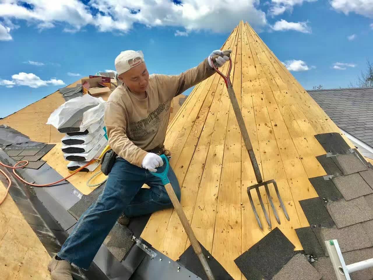 Roofer working on a roof ridge